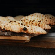 A tray of freshly baked Bosnian bread (also known as Somun bread)