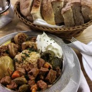 A plate filled with a mix of traditional Bosnian food options