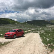 A car on an unpaved road in the Bosnian mountains on the way to Lukomir
