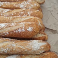 Some Baguettes on a table