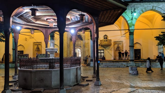 The front courtyard at Gazi Husrev-beg Mosque in Sarajevo at night time