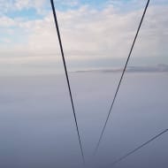 The cables of the Mt. Trebevic Cable car descending into clouds below
