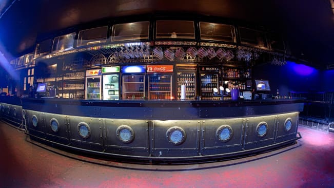 The bar in Trezor nightclub, with drinks stacked in fridges behind it