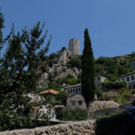 Počitelj village from afar, an old stone village perched on a hillside