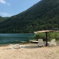 Boračko Lake with a sun chair next to it