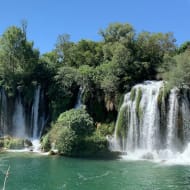 Kravica waterfalls flowing into the small lake at their base
