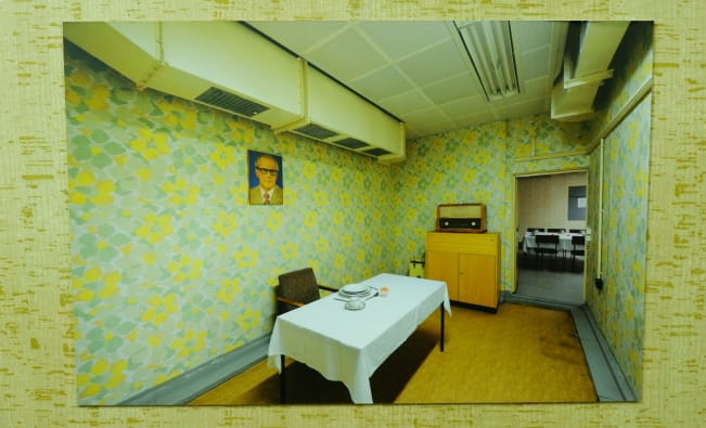 An old photograph of inside Tito's bunker with very Yugoslav decor